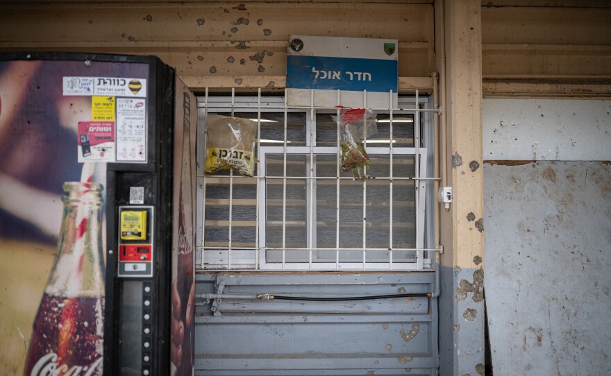 Shrapnel marks are seen on a building damaged by a Hezbollah strike on an Israeli military base near the border with Lebanon in northern Israel on Nov. 28.