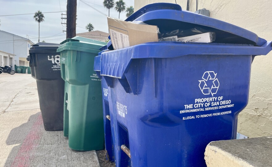 Trash and recycling bins sit curbside in Ocean Beach, Sept. 17, 2025.