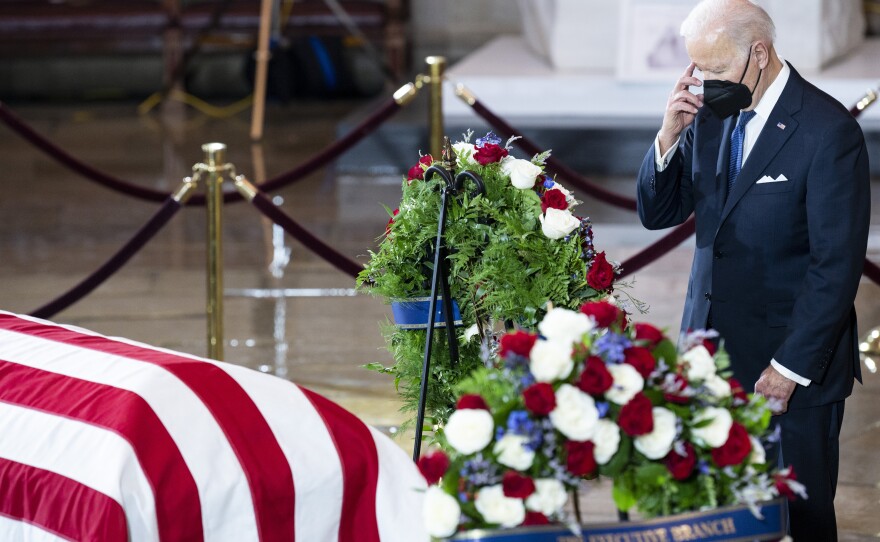 President Joe Biden pays his respects to former Senate Majority Leader Harry Reid in the Rotunda of the U.S. Capitol as Reid lies in state on Wednesday.