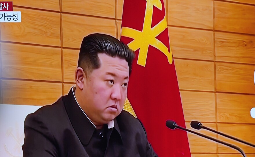 A TV screen shows a news program reporting about North Korea's missile launch with file footage of North Korean leader Kim Jong Un, at a train station in Seoul, South Korea, Wednesday, May 25, 2022.