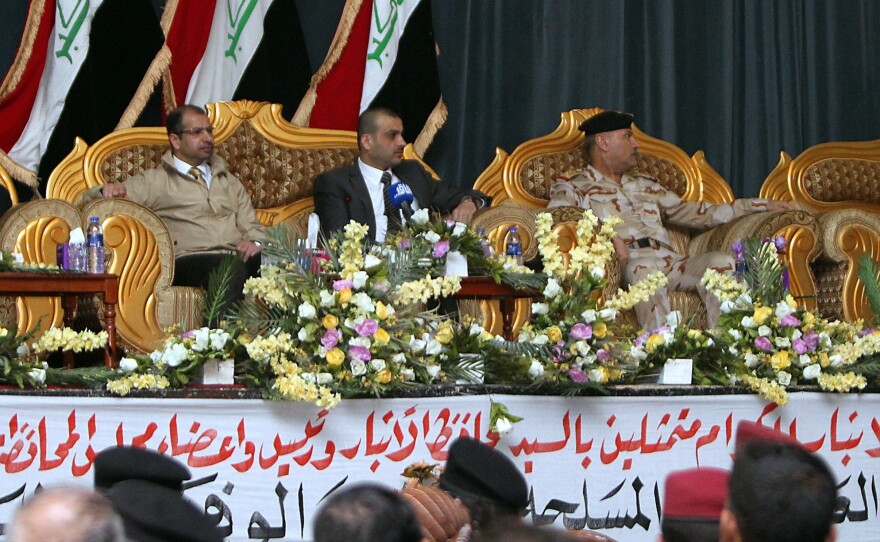 Iraqi parliament speaker Salim al-Jubouri (left) came to at Ain al-Asad air base in mainly Sunni Anbar province to praise the Sunni tribes fighting ISIS and promise them weapons. U.S. special forces sent to train the Sunni tribesmen are already at the base.