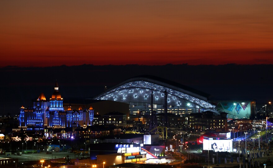 The sun sets at the Olympic Park just ahead of the Opening Ceremony of the Sochi 2014 Winter Olympics at Fisht Olympic Stadium in Russia.