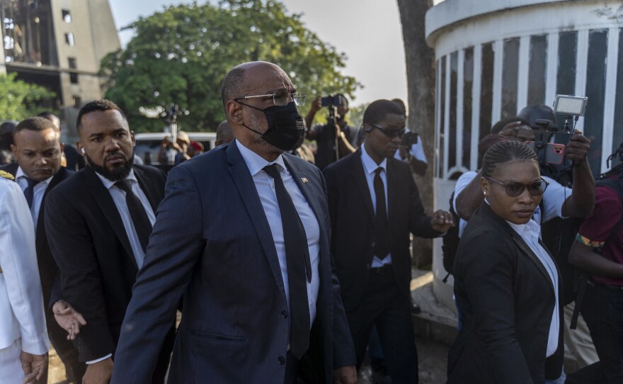 Haitian Prime Minister Ariel Henry arrives at the Champ de Mars, adjacent to the National Palace, to lay a wreath for the anniversary of the death of the leader of the Haitian revolution Jean-Jacques Dessalines in Port-au-Prince on Monday.