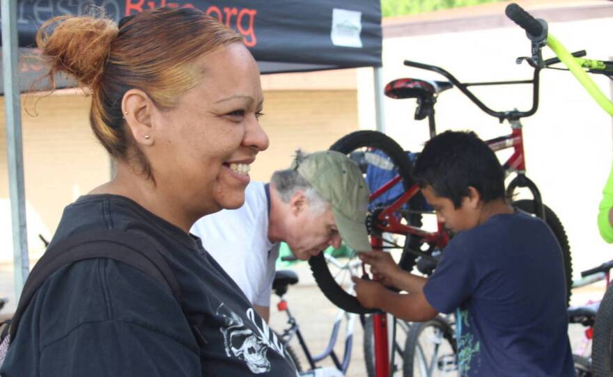 Eloise Betancourt brought her 11-year-old son, Lorenzo (right) to the Fresno, Calif., community event to learn to repair his bike. Lorenzo saved money from his lawn-mowing business, his mom says, to buy bikes at a garage sale for himself and his sisters.