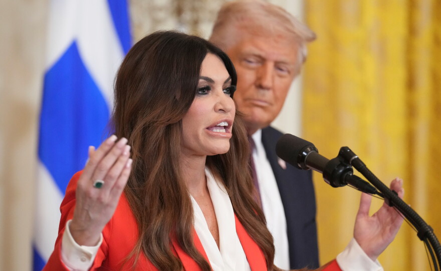 FILE - Kimberly Guilfoyle speaks as President Donald Trump listens at a reception celebrating Greek Independence Day in the East Room of the White House, March 24, 2025, in Washington.