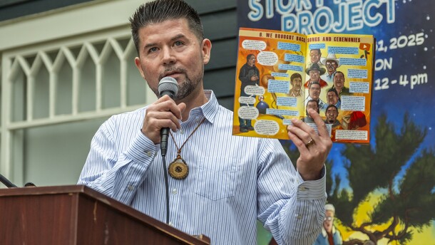 Ethan Banegas reads from the comic book at an event on June 13, 2025 to celebrate the opening of the exhibit at La Jolla Historical Society.