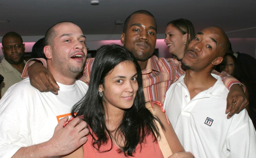 Kim Osorio with <em>The Source</em>'s Boo Rosario, <em>King</em>'s Datwon Thomas and Kanye West in 2003.