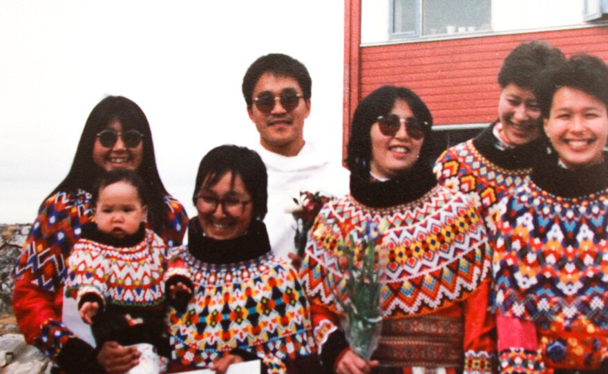 Anda Poulsen, in white jacket, poses for a portrait with his fellow 1989 graduates of Greenland's school of social work in Nuuk.