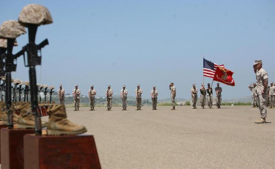<p>Marines with 3rd Battalion, 5th Regiment salute during the playing of taps at a memorial ceremony on April 29 at Camp Pendleton, Calif. Moments before, the Marines fired a 21-gun salute in honor of the 25 fallen warriors of the battalion.</p>