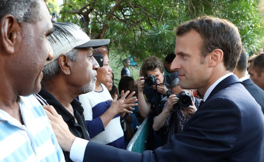 French President Emmanuel Macron meets residents of the Pierre Lenquette residential area on May 4, 2018.