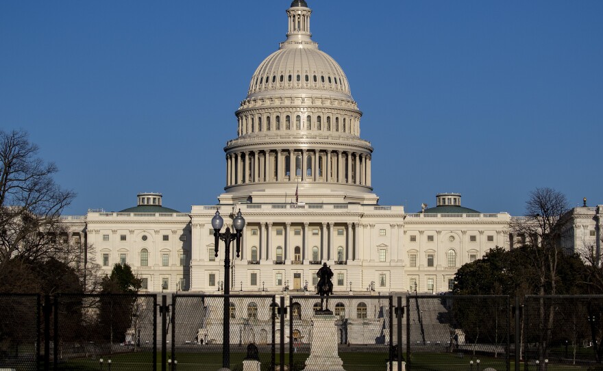 The U.S. Capitol is pictured on Saturday. Fencing is still in place around the Capitol complex after the Jan. 6 insurrection.