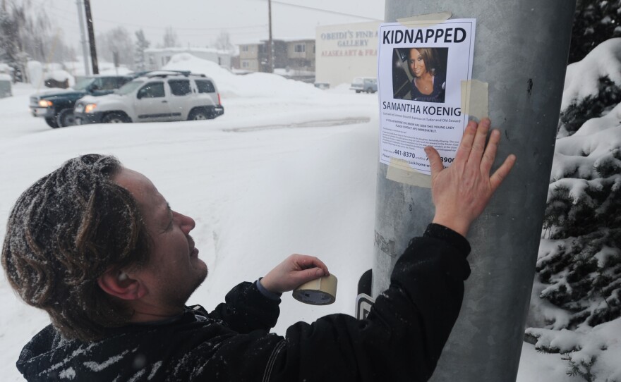 A family friend posts fliers after Samantha Koenig's disappearance in 2012. Koenig's father is now an advocate for a national missing persons database.