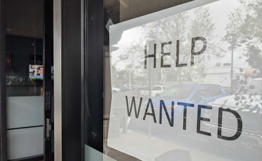 A help wanted sign is posted in the window of a Tierrasanta business. San Diego, Calif. March 31, 2022.