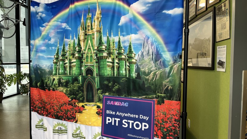 The San Diego Bike Coalition's 'follow the yellow brick bike path' backdrop on display ahead of SANDAG's 'Bike Anywhere Day' in downtown San Diego, CA on May 15, 2024.
