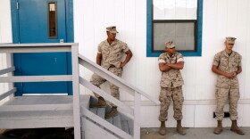 Marines wait outside a building to take psychological tests in September 2009. The military assesses troops in search of clues that might help predict mental health issues.