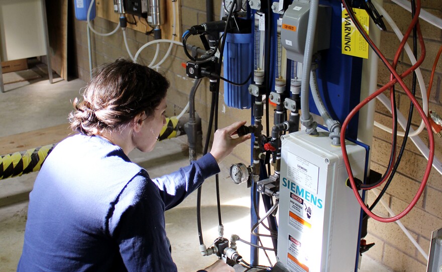 Dr. Adrienne Menniti, a senior process technologist at Clean Water Services, operates the company's high-purity water system. It uses ultra-filtration, reverse osmosis, enhanced oxidation and disinfection to create high-purity water.