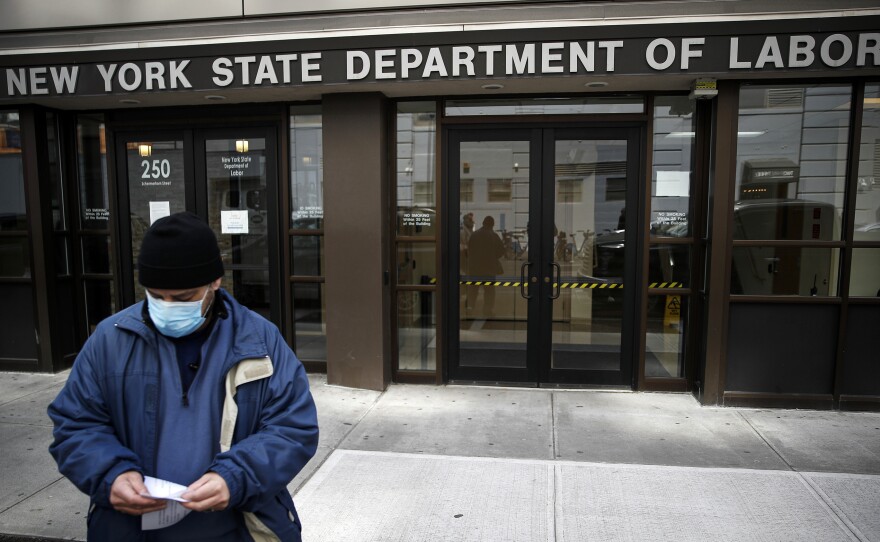 Visitors to the New York Department of Labor are turned away at the door by personnel because of closures over coronavirus concerns in New York on March 18. New York state began offering job protections for those required, or cautioned, to self-isolate or quarantine by a government entity.