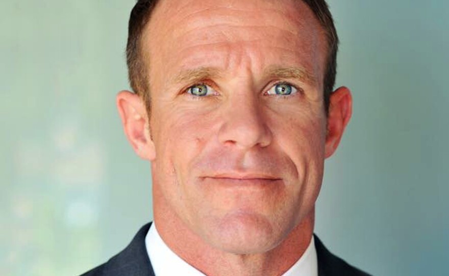 This 2018 photo provided by Andrea Gallagher shows her husband, Navy SEAL Edward Gallagher. Gallagher is facing charges of premeditated murder and other offenses in connection with the fatal stabbing of a teenage Islamic State prisoner under his care in Iraq in 2017 and the shooting of unarmed Iraqi civilians.