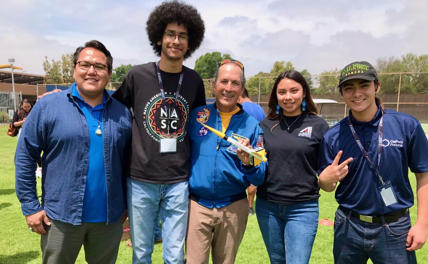 Engineer Aaron Yazzie (Navajo) from NASA's Jet Propulsion Laboratory (left) and Astronaut John Herrington (Chickasaw), the first Native American in space (center), meet with students from the American Indian Science and Engineering Society.