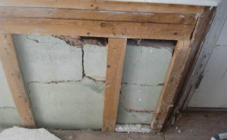 This photo, taken after Superstorm Sandy, shows cracks in the foundation of Doug Quinn's home. The insurance company claimed that the cracks were there before Sandy.