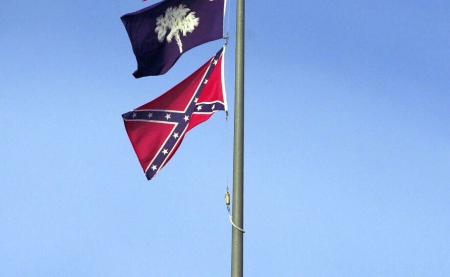 The Confederate flag flies on the dome of the Statehouse in Columbia, S.C., in 2000.