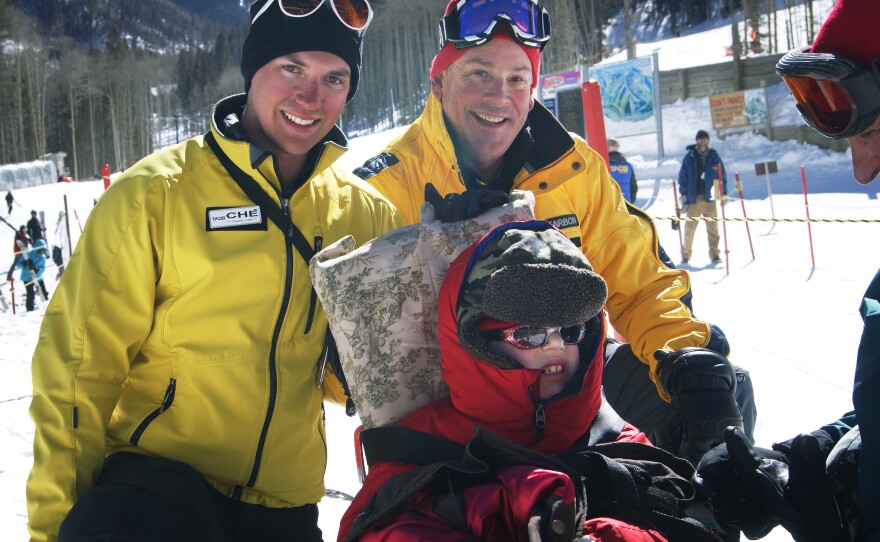 Tilghman with his instructors Ché Pirozak-Lillick (left) and Stagg after the first day of ski lessons.