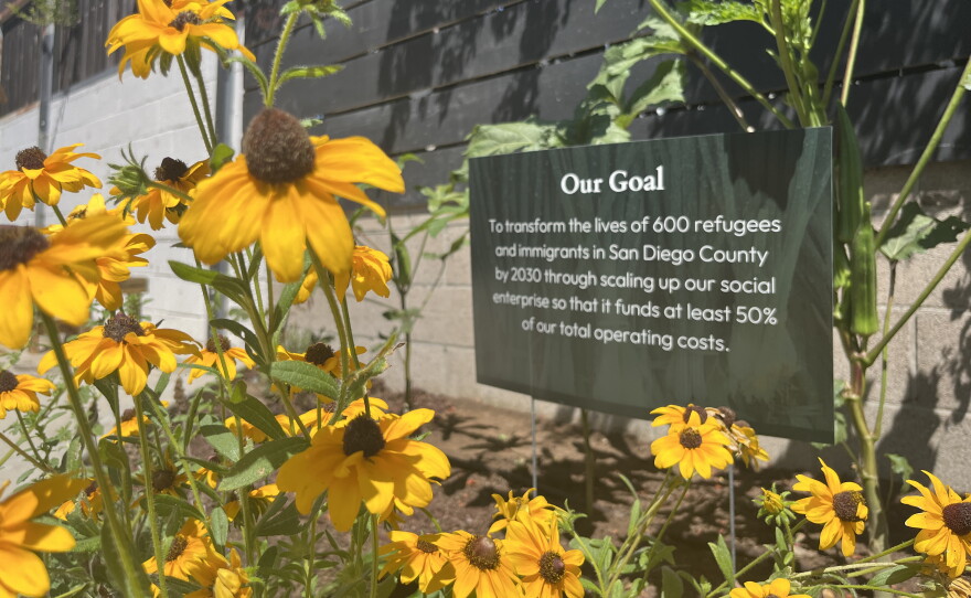 A planter at Make Cafe boasts a sign with goals from the job readiness program, Aug. 21, 2026.