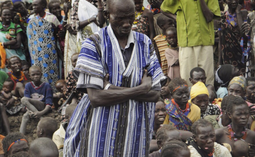 People who escaped ethnic violence in Jonglei state wait for food rations at a World Food Program distribution center on Thursday. South Sudan gained independence just six months ago, and already ethnic tensions inside the new country have forced tens of thousands to flee their homes.