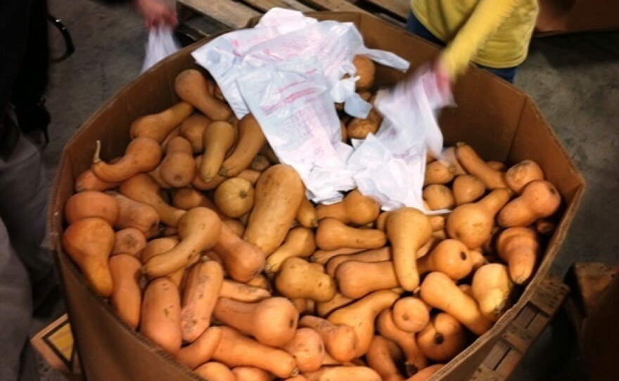 Volunteers at Second Harvest Food Bank of Middle Tennessee sort 50 pallets of  butternut squash. Bringing in more produce is one way food banks plan to meet  new nutrition goals.