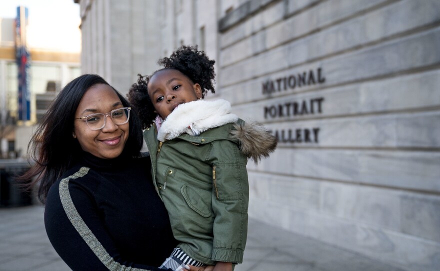 Jessica Curry Morton holds her daughter Parker outside of the National Portrait Gallery. This was their first time being back to the gallery since the book published in October.