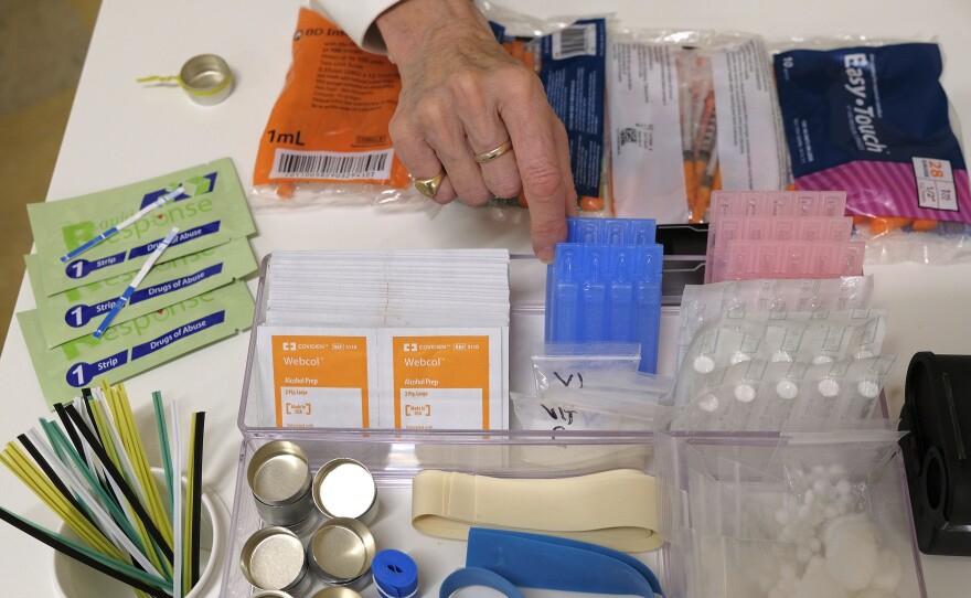 Supplies sit on a check-in desk at a model of a hypothetical injection site in San Francisco, pictured here in September 2018. Local leaders from San Francisco are among a dozen local officials urging a federal court to allow an effort to open a supervised injection site in Philadelphia.