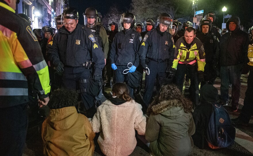 Boston police move to arrest pro-Palestinian supporters who were blocking the road after the clearing of Emerson College's encampment early Thursday morning.
