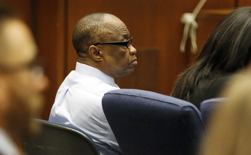 Defendant Lonnie Franklin Jr. listens during opening statements of his trial. Franklin is accused of serial murders that terrorized South LA.