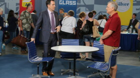 Peter Loughrey (left) appraises a Charles and Ray Eames table and chairs set in Omaha, Neb.