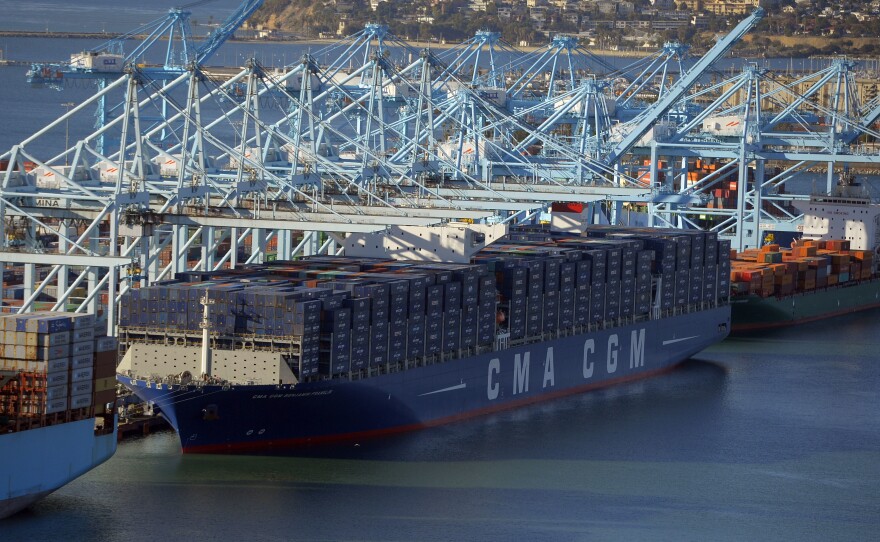 After its maiden voyage from China, the largest container ship to ever make port in North America, unloads its cargo in the Port of Los Angeles on Dec. 26, 2015. The major shipping companies in Europe and Asia began ordering the state-of-the-art, supersized ships back in 2011, when times were better.