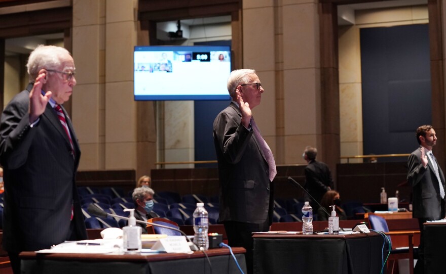 Former Attorney General Michael B. Mukasey (from left), former Deputy Attorney General Donald Ayer and John W. Elias, a current Justice Department prosecutor, are sworn in at a hearing of the House Judiciary Committee on Wednesday.