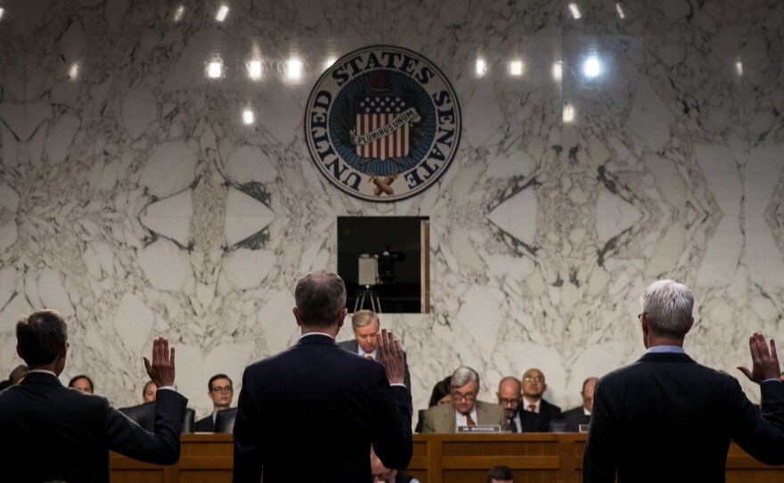 Richard Salgado (from left), director of law enforcement and information security at Google; Sean Edgett, acting general counsel at Twitter; and Colin Stretch, general counsel at Facebook, are sworn in during a Senate Judiciary Subcommittee on Crime and Terrorism hearing on Oct. 31.