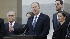 San Diego Mayor Kevin Faulconer, center, discusses California's growing homeless crisis during a news conference in Sacramento, Calif., Wednesday, Feb. 21, 2018. 