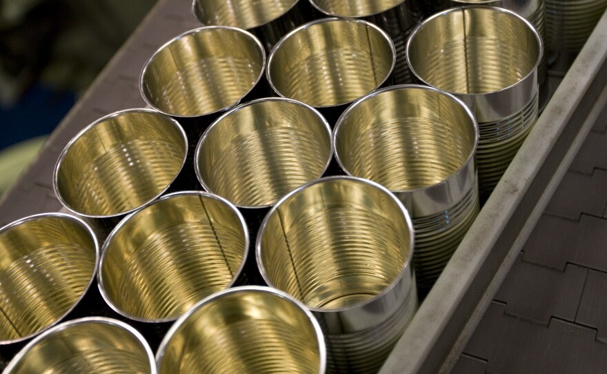 Cans are lined up at the Pacific Coast Producers plant in Oroville, Calif. The company, which cans fruits for sale in supermarkets, says new tariffs imposed by the Trump administration on steel imports will eat into its profits.
