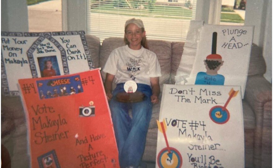 Makayla Steiner poses with campaign posters for student council that her mom, Camille Callister, helped her make.