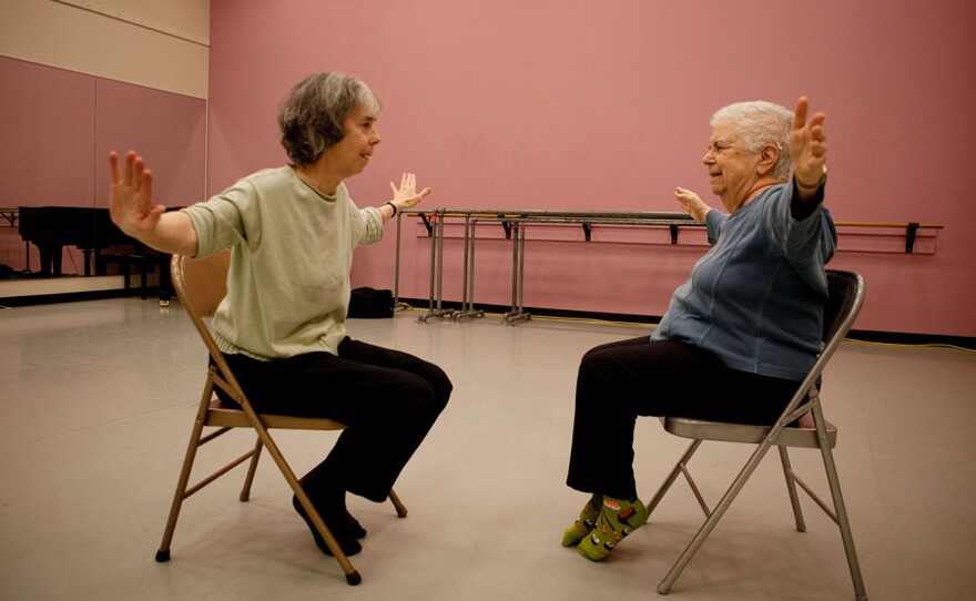 Classmates Anne Davis (left) and Phyllis Richman get in sync with each other during a mirror game in their dance class in Silver Spring, Md.