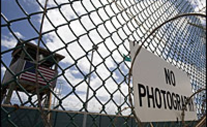 This file photo from April 24 shows the outer fence and a guard tower at the U.S. Naval Station in Guantanamo Bay, Cuba. The Senate on Wednesday failed to pass a measure restoring detainees' habeas corpus rights.