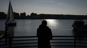 J.M., who prefers to use his initials for privacy, looks out at the San Francisco Bay at Jack London Square, where he walks almost daily for exercise and because he enjoys looking at the water, in Oakland on Dec. 1, 2025. JM received housing support through CARE Court and now lives within walking distance of Jack London.