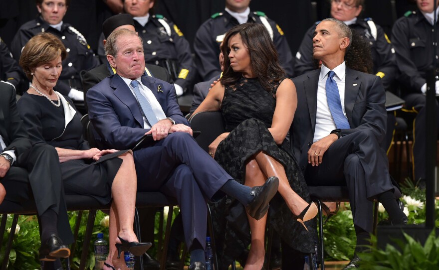 Former first lady Laura Bush, former President George W. Bush, first lady Michelle Obama and President Obama attend an interfaith memorial service for the police officers killed in Dallas.