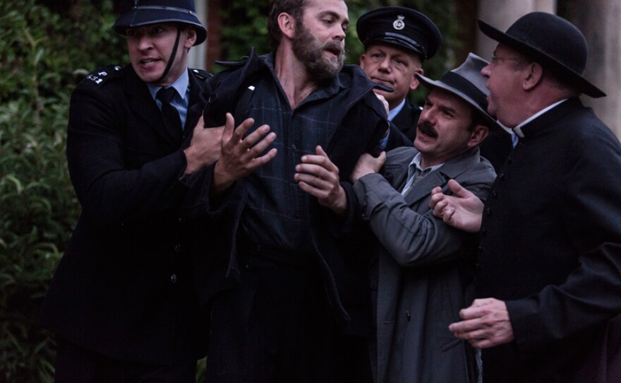 Sid Carter (ALEX PRICE), Inspector Mallory (JACK DEAM) and Father Brown (MARK WILLIAMS) in a scene from “The Sins Of Others.”