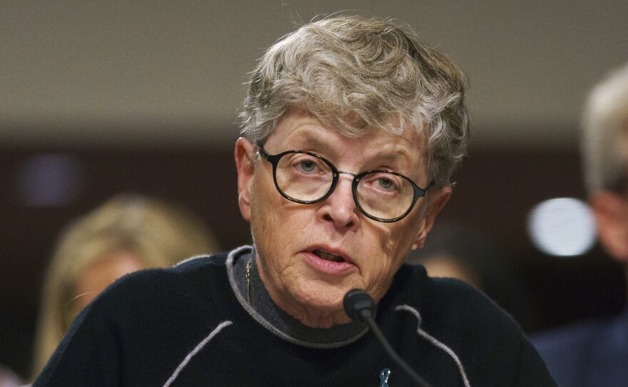 Former Michigan State President Lou Anna Simon, pictured before a Senate subcommittee in Washington, was charged on Tuesday with lying to police conducting an investigation of Larry Nassar's sexual abuse.