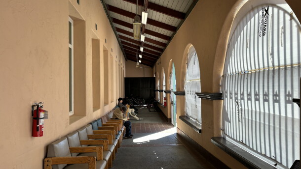 People sit in the chairs lining the alcove of the Father Joe's Villages day center on Oct. 14, 2026.