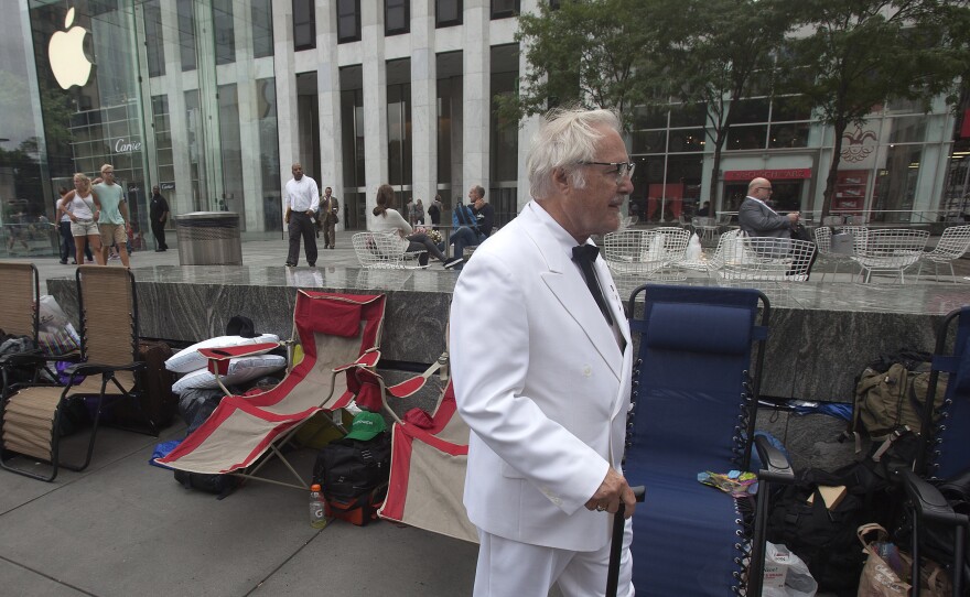 Among Apple fans, anticipation has been building over the company's possible release of a smartwatch Tuesday. In Manhattan, a man dressed as Colonel Sanders was among those who gathered at an Apple Store ahead of today's event.