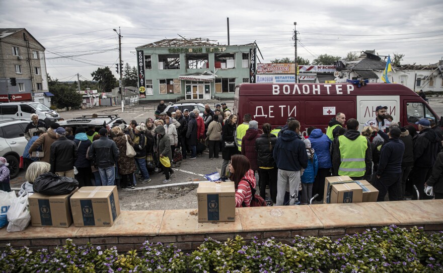 Humanitarian aid is distributed in Balakliya following the retreat of Russian troops from Ukraine's Kharkiv region, on Sept. 11.