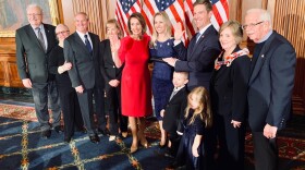 Congressman Mike Levin poses for a photo with his family and Democratic House Majority Speaker Nancy Pelosi after a swearing-in ceremony on January 3, 2019.